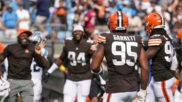 Sep 11, 2022; Charlotte, North Carolina, USA; Cleveland Browns celebrate the close win as Cleveland Browns defensive end Myles Garrett (95) and defensive end Jadeveon Clowney (90) walk to the sideline during the second half against the Carolina Panthers at Bank of America Stadium. Mandatory Credit: Jim Dedmon-USA TODAY Sports